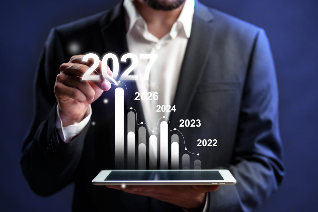Business professional analyzing growth trends for future planning through digital graphs